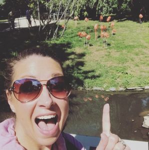 Mrs. Curley pointing to the flamingos